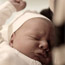 Mother holding baby before Bris